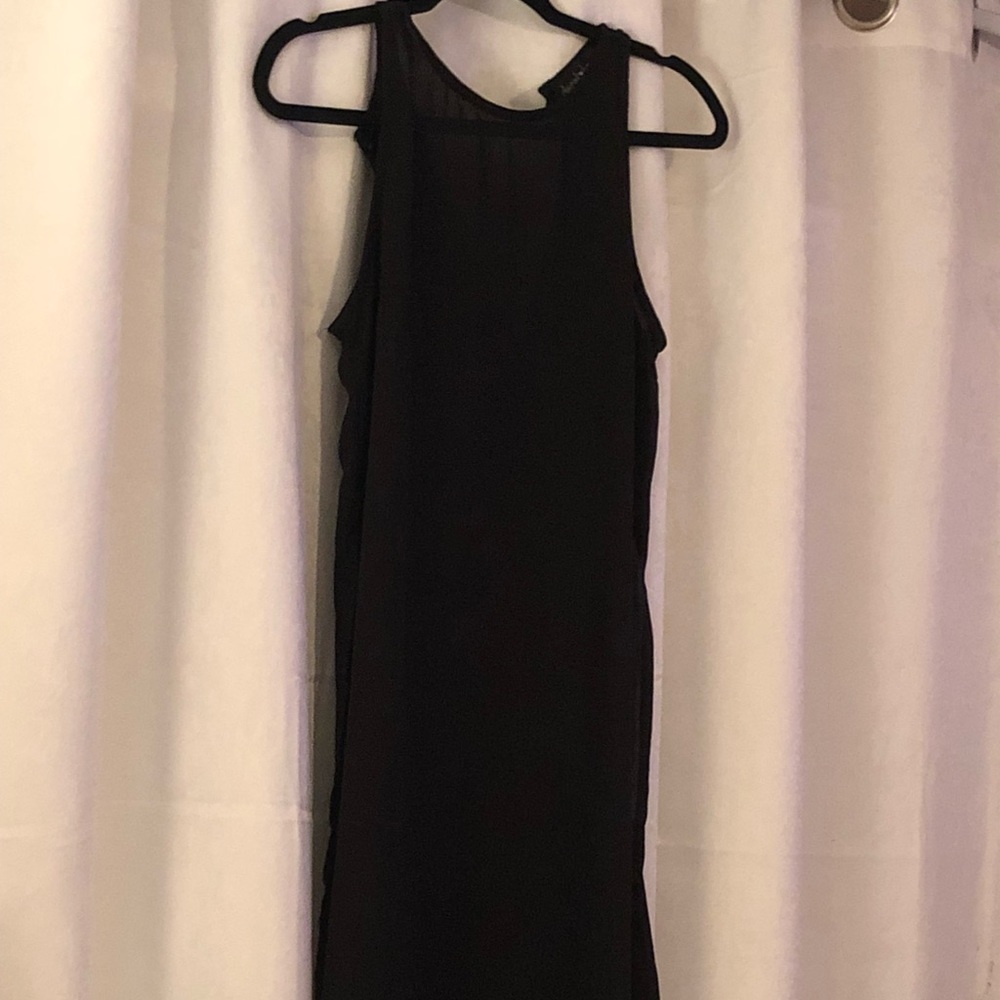Black tunic cut out on both sides